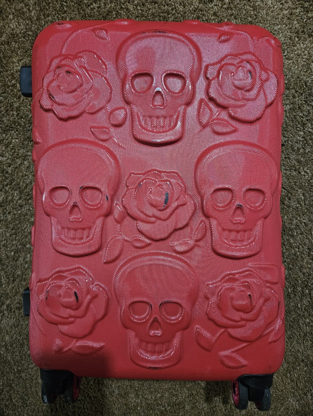 Decorative skull-embossed suitcase